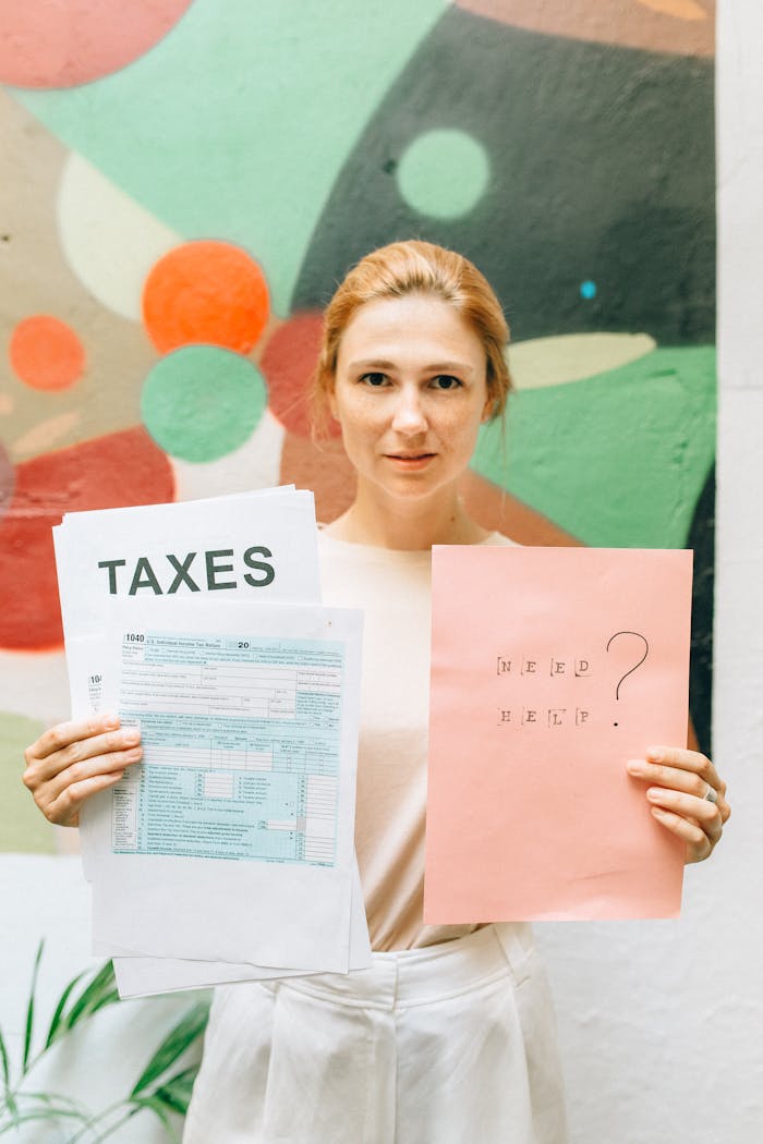 Home A professional woman holding tax documents and a